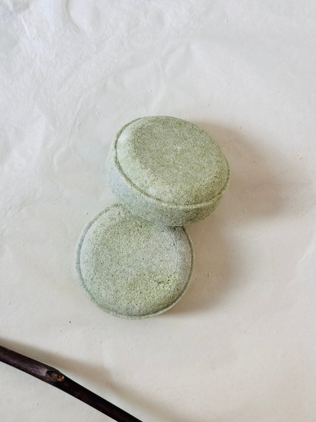 Two gray stone containers on a white background