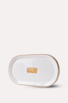 Rectangular ceramic tray with gold rim on a white background
