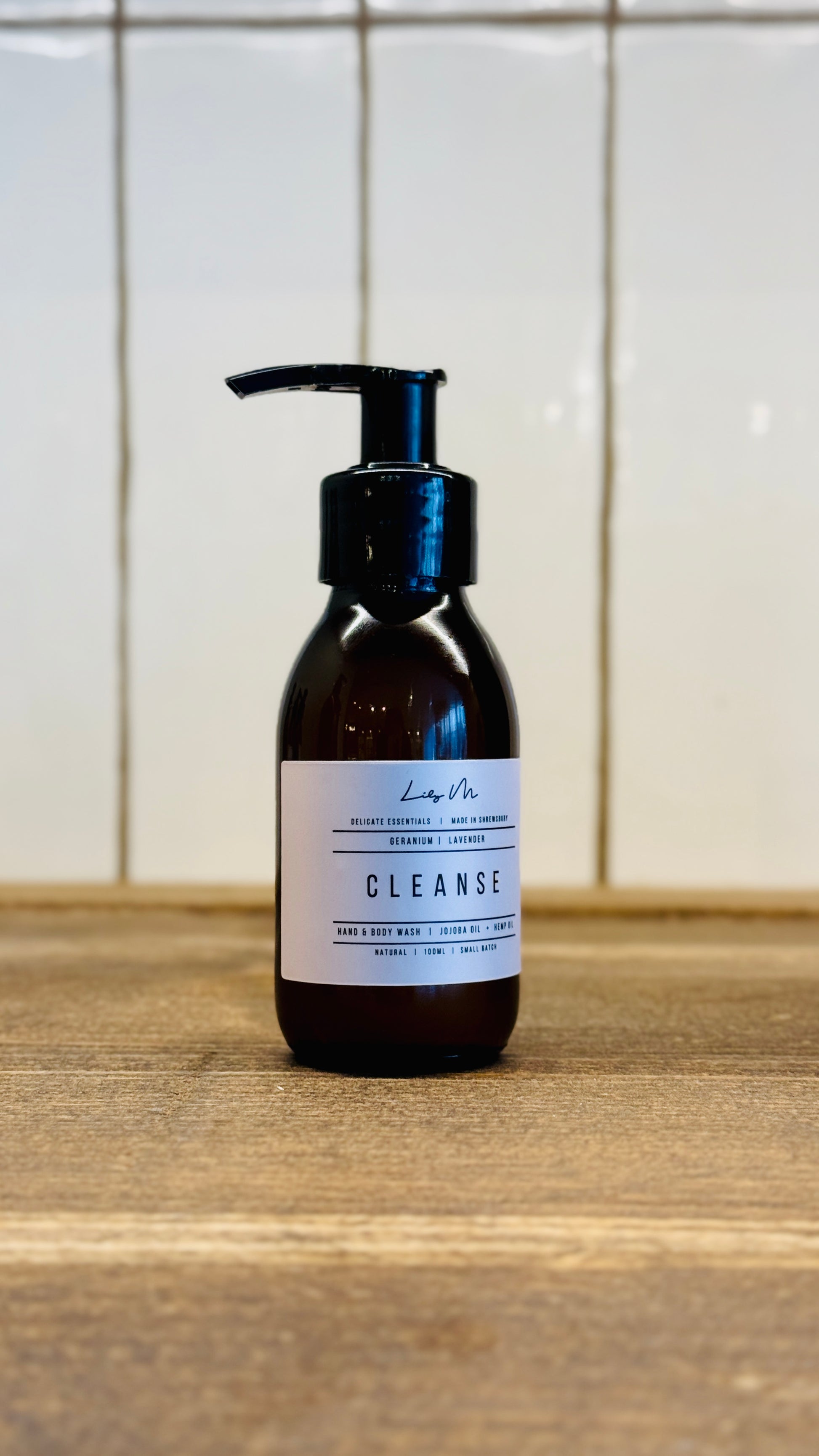 100ml travel size amber glass bottle with a pump with hand wash inside 
