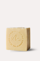 Bar of soap with a circular logo on a white background