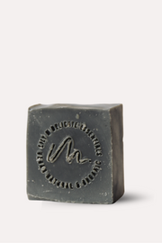 Bar of soap with a brand logo on a white background