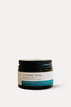 Jar of deodorant balm with a black lid on a white background