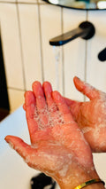 close up of the handwash being used with bubbles on the hand 